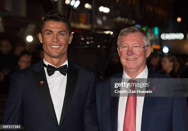 Cristiano Ronaldo and Sir Alex Ferguson arriving at the World Premiere of "Ronaldo" at the Vue West End in London