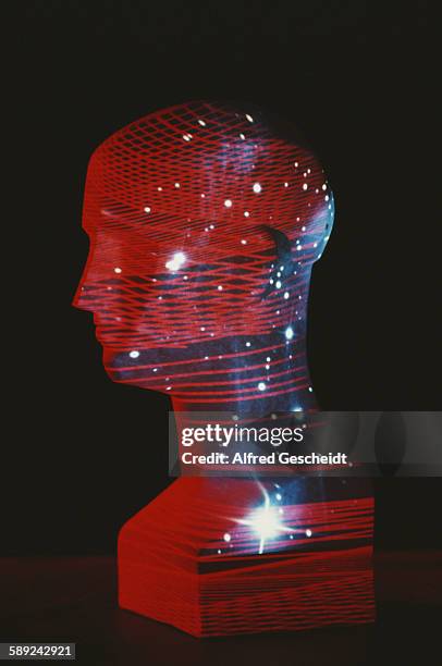 Mannequin head with an image of stars and a computerised grid superimposed over it, 1985.