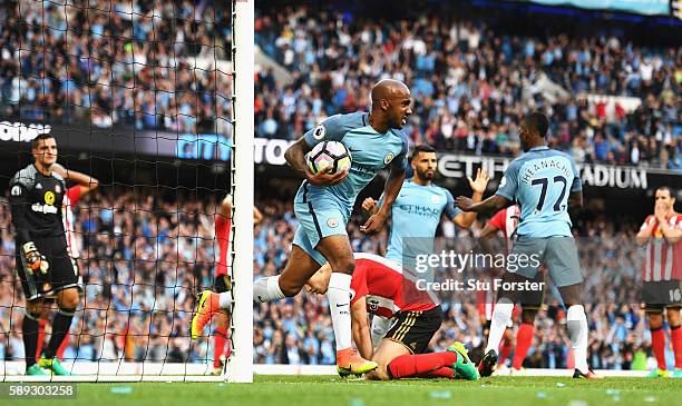 Fabian Delph of Manchester City celebrates after Paddy McNair of Sunderland scored a own goal for Manchester City's second goal of the game during...