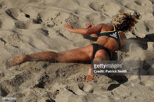 Laura Ludwig of Germany dives for the ball during a Women's Round of 16 match between Switzerland and Germany on Day 8 of the Rio 2016 Olympic Games...