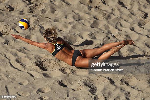 Laura Ludwig of Germany dives for the ball during a Women's Round of 16 match between Switzerland and Germany on Day 8 of the Rio 2016 Olympic Games...