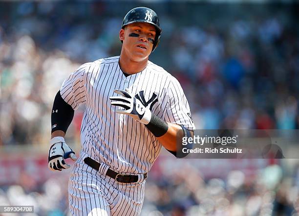 Aaron Judge of the New York Yankees rounds the bases after he hit a home run in his first MLB at bat during the second inning of a game against the...