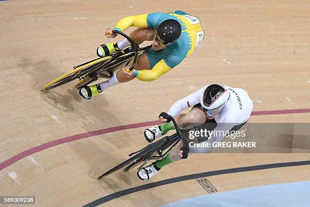 Germany's Joachim Eilers competes against Australia's Matthew Glaetzer in the men's Sprint quarter-finals track cycling event at the Velodrome during...