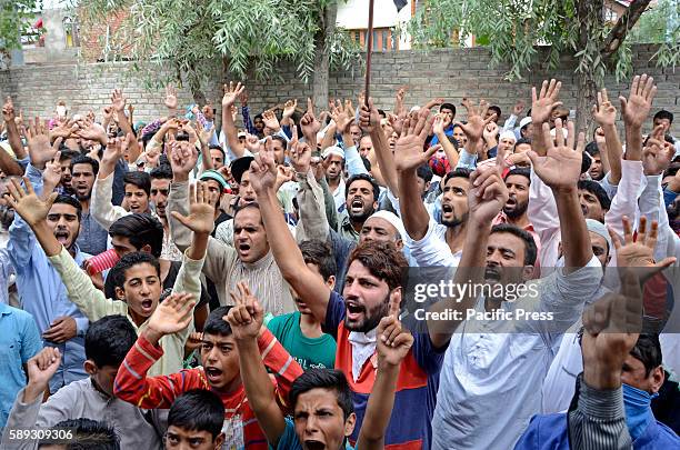 Kashmiri people raise anti-India and pro-Kashmir slogans during a protest rally after Friday prayers in Bemina area of Srinagar Kashmir valley...