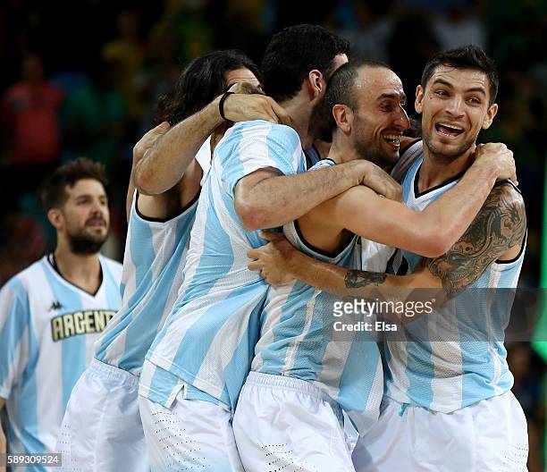 Manu Ginobili and Carlos Delfino of Argentina celebrate the 111-107 double overtime win over Brazil during the Men's Preliminary Round Group B match...