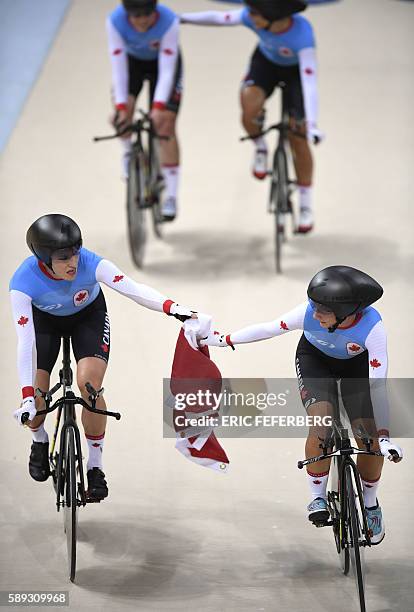 Canada's Allison Beveridge, Canada's Jasmin Glaesser, Canada's Kirsti Lay and Canada's Georgia Simmerling celebrate with a flag after winning bronze...