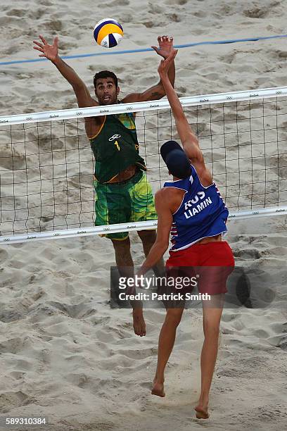 Pedro Solberg of Brazil vies against Nikita Liamin of Russia during a Men's Round of 16 match between Brazil and Russia on Day 8 of the Rio 2016...