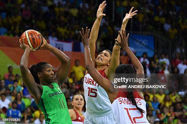 Turkey's centre Lara Sanders and Turkey's power forward Tilbe Senyurek defend against Brazil's power forward Clarissa Santos during a Women's round...