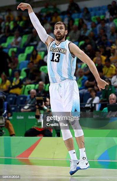 Andres Nocioni of Argentina celebrates his three point shot in the first hafl against Brazil during the Men's Preliminary Round Group B match on day...