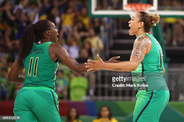 Clarissa Santos and Erika Souza of Brazil celebrate a basket during the Women's round Group A basketball match between Brazil and Turkey on Day 7 of...