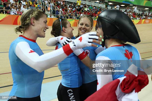 Allison Beveridge, Jasmin Glaesser, Kirsti Lay and Georgia Simmerling of Canada celebrate winning the bronze medal after the Women's Team Pursuit...