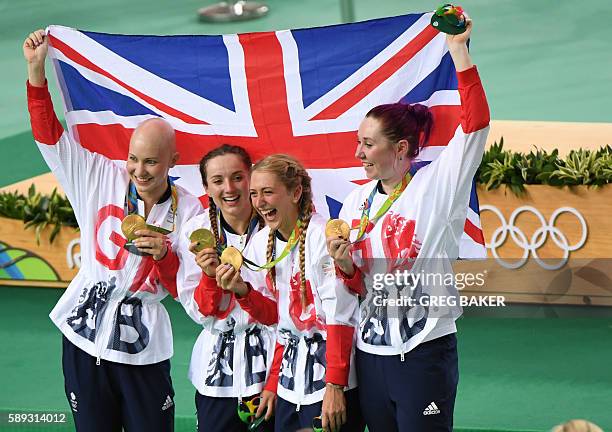 Gold medallists Britain's Joanna Rowsell-Shand, Britain's Elinor Barker, Britain's Laura Trott and Britain's Katie Archibald pose with a flag and...