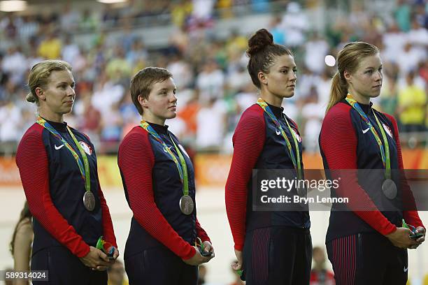 Silver medalist Sarah Hammer, Kelly Catlin, Chloe Dygert and Jennifer Valente of the United States celebrate on the podium at the medal ceremony for...
