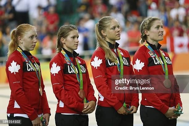 Bronze medalists Allison Beveridge, Jasmin Glaesser, Kirsti Lay and Georgia Simmerling of Canada celebrate on the podium at the medal ceremony for...