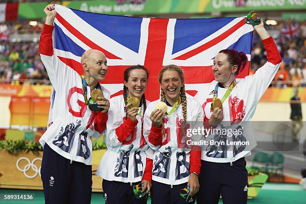 Gold medalists Laura Trott, Joanna Rowsell-Shand, Katie Archibald, Elinor Barker of Great Britain celebrate on the podium at the medal ceremony for...