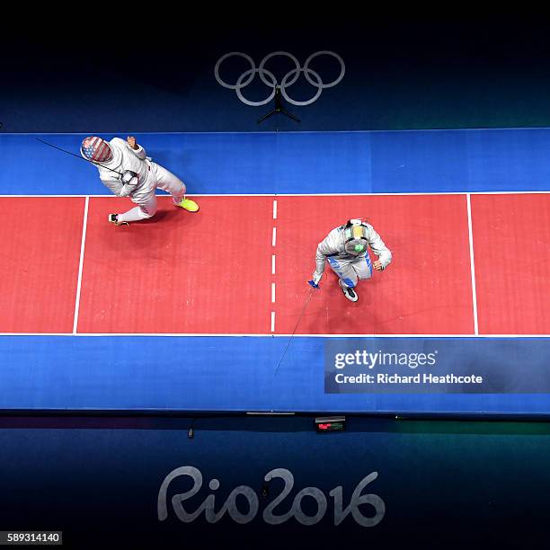 Ibtihaj Muhammad of the United States celebrates against Rossella Gregorio of Italy during the Women's Sabre Team bronze medal match between United...