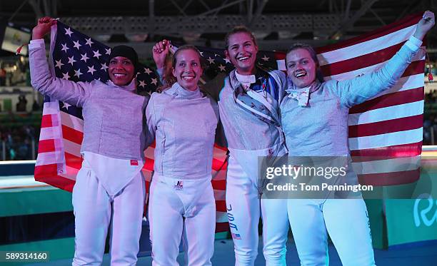 Ibtihaj Muhammad, Mariel Zagunis, Monica Aksamit and Dagmara Wozniak of the United States celebrate winning the Women's Sabre Team bronze medal match...