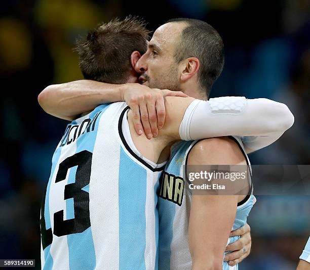 Andres Nocioni and Manu Ginobili of Argentina celebrate the 111-107 double overtime win over Brazil during the Men's Preliminary Round Group B match...