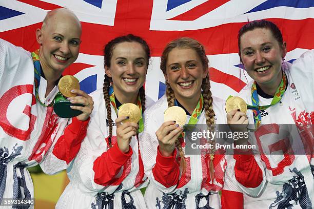 Gold medalists Laura Trott, Joanna Rowsell-Shand, Katie Archibald, Elinor Barker of Great Britain celebrate on the podium at the medal ceremony for...