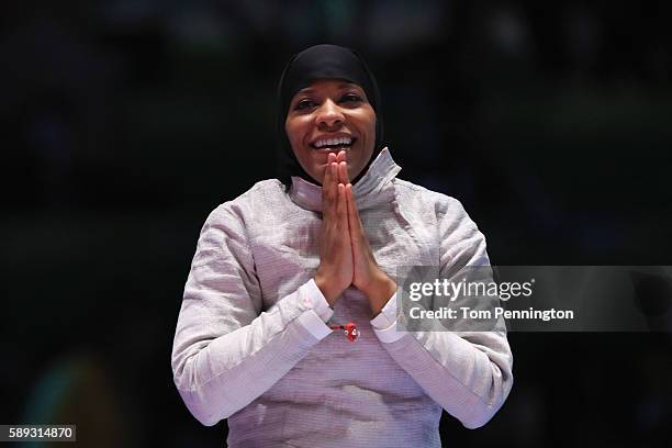 Ibtihaj Muhammad of the United States celebrates after the United States wins the Women's Sabre Team bronze medal match between United States and...