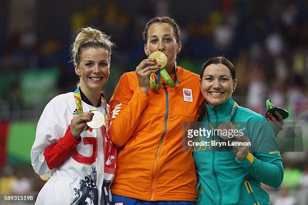 Silver medalist Rebecca James of Great Britain, gold medalist Elis Ligtlee of the Netherlands and bronze medalist Anna Meares of Australia celebrate...