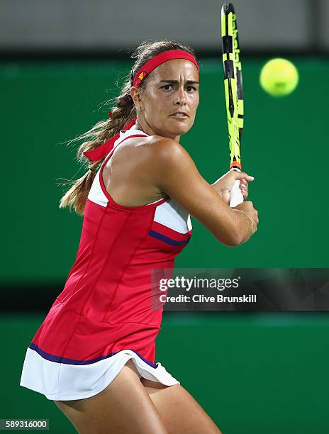 Monica Puig of Puerto Rico returns a shot against Angelique Kerber of Germany during the Women's Singles Gold Medal Match on Day 8 of the Rio 2016...