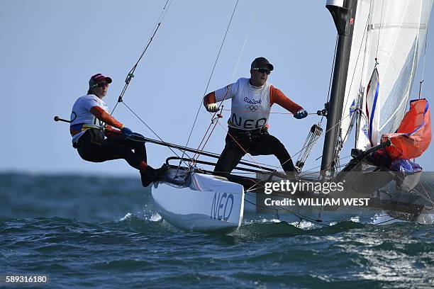 Netherlands' Mandy Mulder and Netherlands' Coen De Koning compete in the Nacra 17 Mixed sailing class on Guanabara Bay in Rio de Janerio during the...