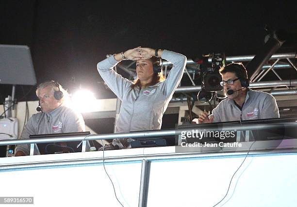 Commentator for French TV Laure Manaudou - between Philippe Lucas and Alexandre Boyon - reacts during the Men's 50m Freestyle Final her brother...