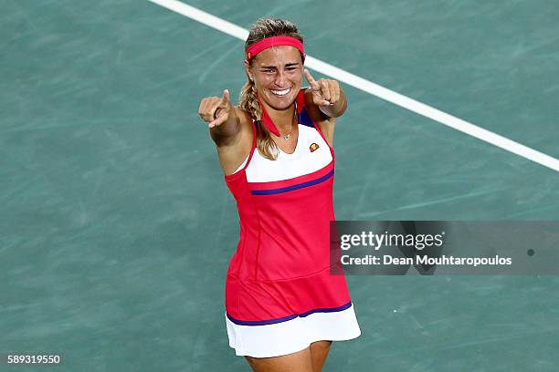 Monica Puig of Puerto Rico reacts after defeating Angelique Kerber of Germany in the Women's Singles Gold Medal Match on Day 8 of the Rio 2016...