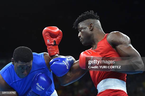 Nigeria's Efe Ajagba fights Trinidad and Tobago's Nigel Paul during the Men's Super Heavy at the Rio 2016 Olympic Games at the Riocentro - Pavilion 6...