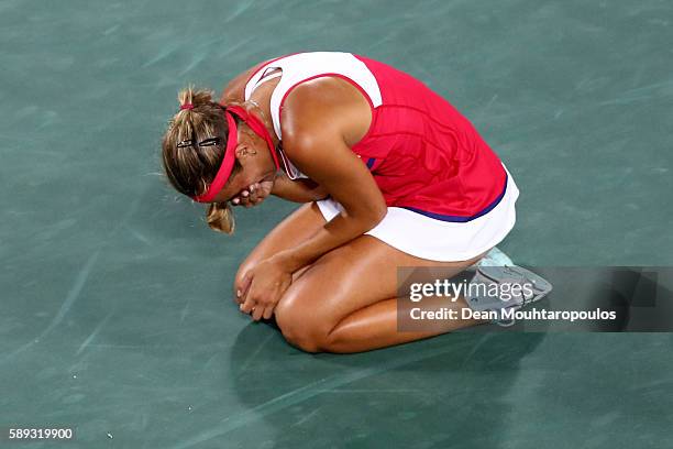 Monica Puig of Puerto Rico reacts after defeating Angelique Kerber of Germany in the Women's Singles Gold Medal Match on Day 8 of the Rio 2016...