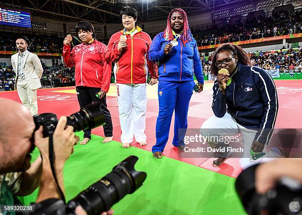 Over 78kg medallists get the attention of the photographers. L-R: Bronzes; Kanae Yamabe of Japan and Song Yu of China, Silver; Idalys Ortiz of Cuba...
