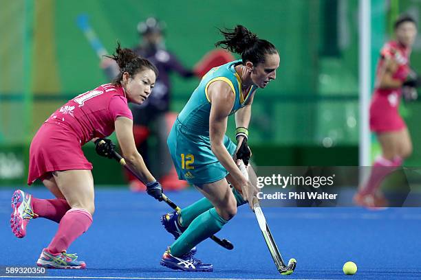 Madonna Blyth of Australia passes the ball in the Women's Pool B match between Australia and Japan on Day 8 of the Rio 2016 Olympic Games at the...