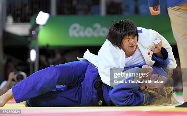 Kanae Yamabe of Japan throws Santa Pakenyte of Lithuania tp win in the Women's +78kg on Day 7 of the Rio 2016 Olympic Games at Carioca Arena 2 on...