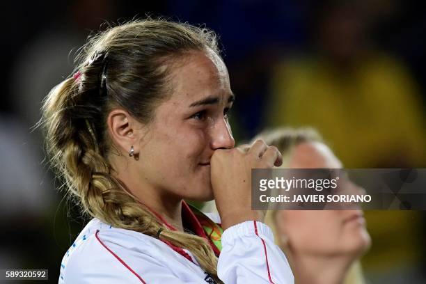 Gold medallist Puerto Rico's Monica Puig reacts during the podium ceremony of the women's singles tennis event at the Olympic Tennis Centre of the...