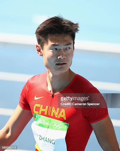 Peimeng Zhang of China competes in the Men's 100 metres heats on Day 8 of the Rio 2016 Olympic Games at the Olympic Stadium on August 13, 2016 in Rio...