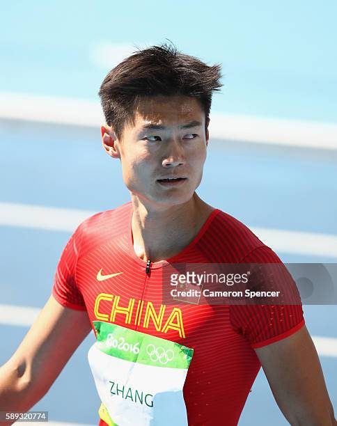 Peimeng Zhang of China competes in the Men's 100m Round 1 on Day 8 of the Rio 2016 Olympic Games at the Olympic Stadium on August 13, 2016 in Rio de...