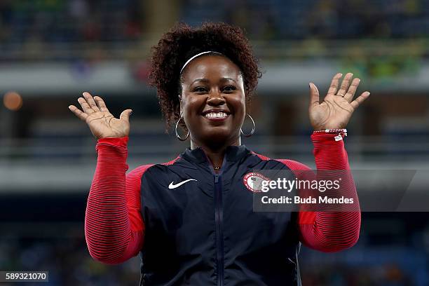 Gold medalist Michelle Carter of the United States celebrates on the podium during the medal ceremony for the Women's Shot Put on Day 8 of the Rio...