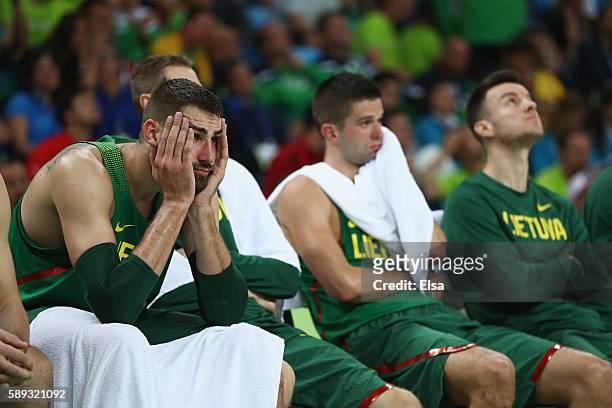Jonas Valanciunas of Lithuania looks on from the bench during the Men's Preliminary Round Group B between Spain and Lithuania on Day 8 of the Rio...