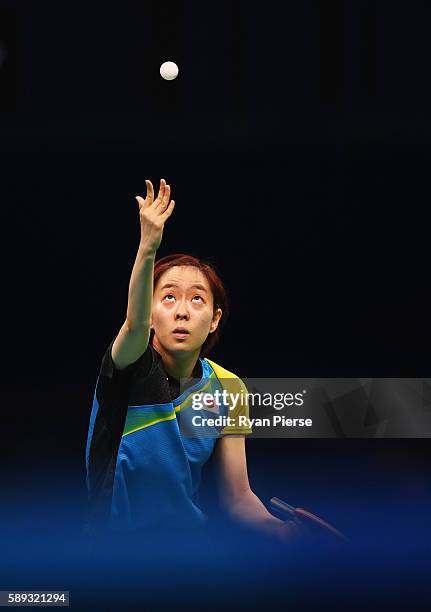 Kasumi Ishikawa of Japan serves during the Table Tennis Women's Team Round Quarter Final between Japan and Austria during Day 8 of the Rio 2016...