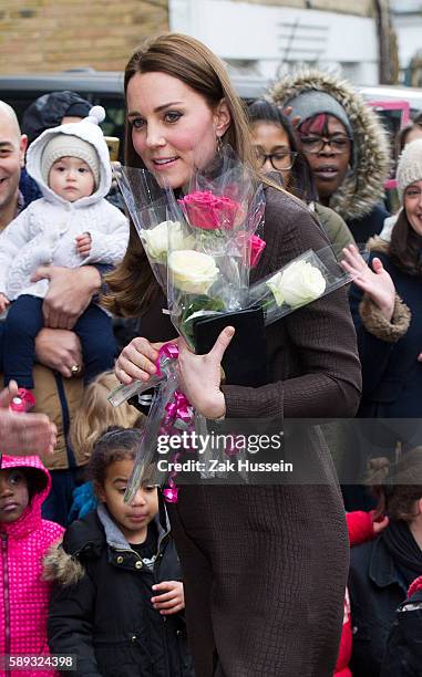 Catherine, Duchess of Cambridge, wearing a brown silk Hobbs dress, attends an event hosted by The Fostering Network to celebrate the work of foster...