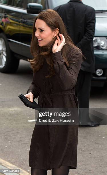 Catherine, Duchess of Cambridge, wearing a brown silk Hobbs dress, attends an event hosted by The Fostering Network to celebrate the work of foster...