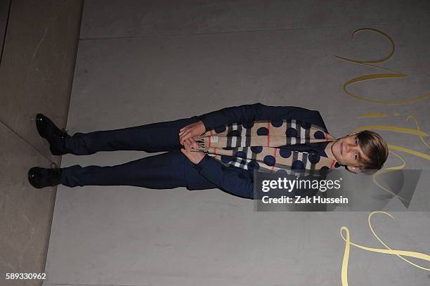 Romeo Beckham arriving at the premiere of the Burberry Festive Film in London