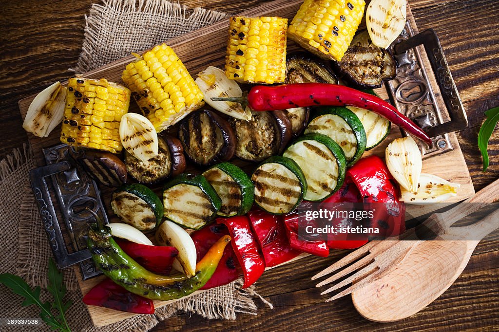 Homemade organic grilled summer vegetables on rustic table viewed from above