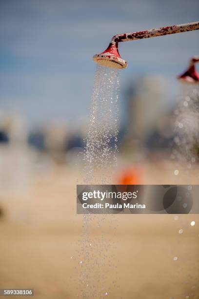 shower on the beach - olimpiadas stock pictures, royalty-free photos & images