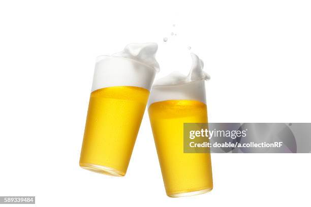 two pints of beer - beer splashing stock pictures, royalty-free photos & images