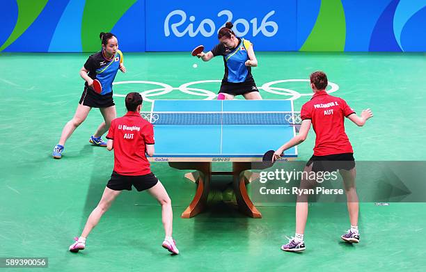 Ai Fukuhara and Mima Ito of Japan play against Austria during the Table Tennis Women's Team Round Quarter Final between Japan and Austria during Day...