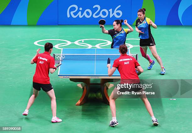 Ai Fukuhara and Mima Ito of Japan play against Austria during the Table Tennis Women's Team Round Quarter Final between Japan and Austria during Day...