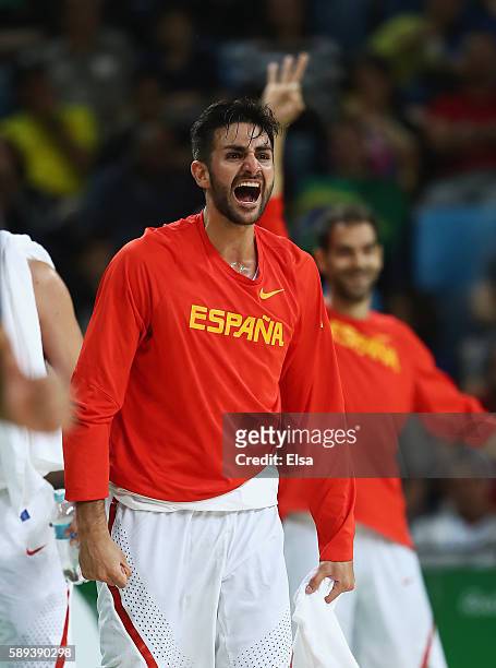 Ricky Rubio and Jose Calderon of Spain celebrate a play during the Men's Preliminary Round Group B between Spain and Lithuania on Day 8 of the Rio...