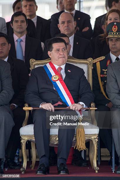 President of Paraguay, Horacio Cartes looks on during a military parade as a part of Paraguay National Holidays celebrations at Avenida costanera on...